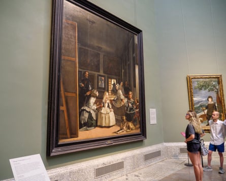 People look at the Las Meninas painting by Diego Velázquez in the Museo del Prado art gallery, Madrid, Spain.