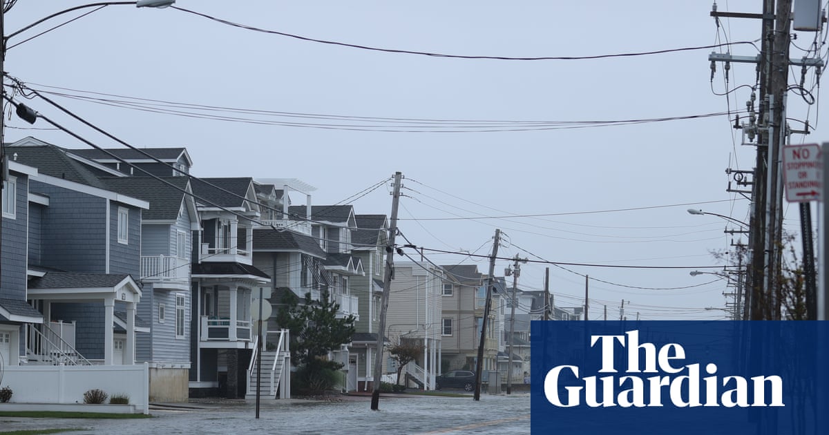 Nor’easter brings flooding to US east coast as storm sweeps away homes in Alaska