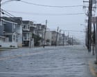 US east coast braces for nor’easter while storm sweeps away homes in Alaska