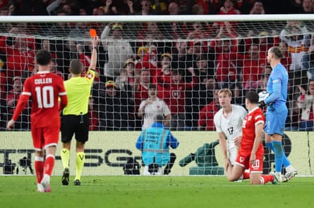 NorwayâÂÂs Torbjørn Heggem is shown a red card for a foul on Walesâ Daniel James