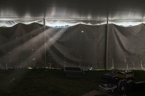 Sunlight leaks through a tent wall.