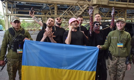 Kalush Orchestra were welcomed by members of Ukraine's state border guard service at the Ukraine-Poland border.