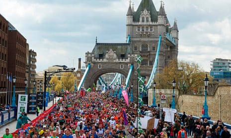 Runners cross Tower Bridge in the 2016 London Marathon.