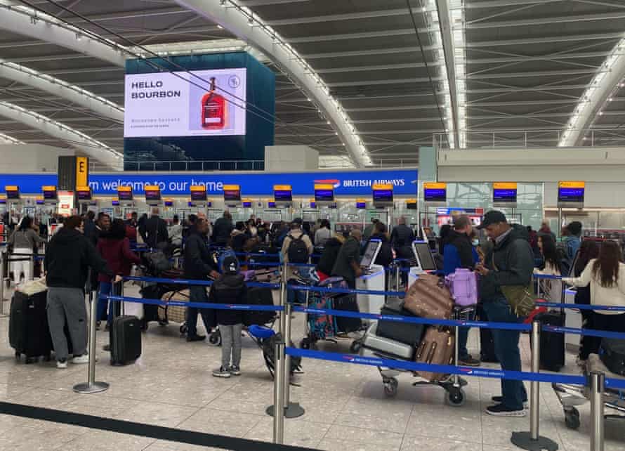 People queue to check in at Heathrow Terminal 5 on Monday 4 April.