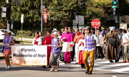 people walking and carrying signs
