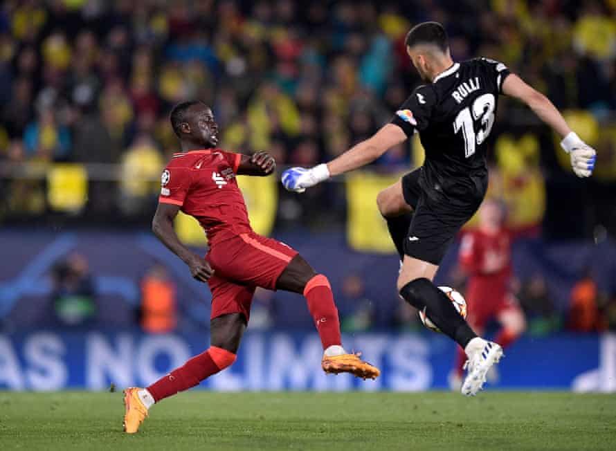 Sadio Mane nickes the ball from Geronimo Rulli before scoring the third goal.