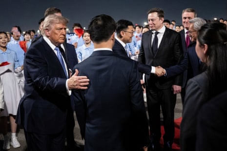 Donald J. Trump watches as members of his delegation, including Tesla’s Elon Musk and Nvidia president Jensen Huang, are greeted by Han Zheng at Beijing international airport.