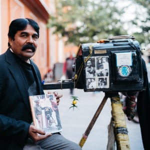 On one of Jaipur’s main streets, near the Hawa Mahal (Palace of the Winds), Teekam Chand is setting up his World War I era box camera to take his next portrait.