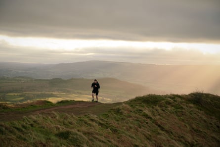 Terry Rosoman running in the Welsh hills