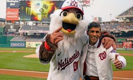 Sunak poses with Screech, the Washington Nationals’ mascot, portion attending the team’s crippled against Arizona Diamondbacks