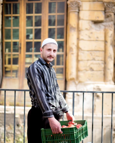 Naseem Abou Mansour, the son of a Druze sheikh, sells pomegranates at the Souk el Tayeb farmers’ market in Beirut.