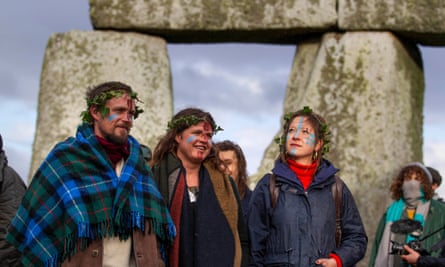 People with face paint at Stonehenge
