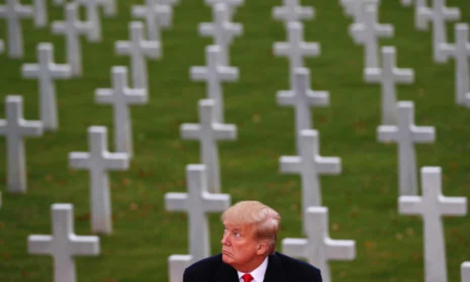Donald Trump in front of graves