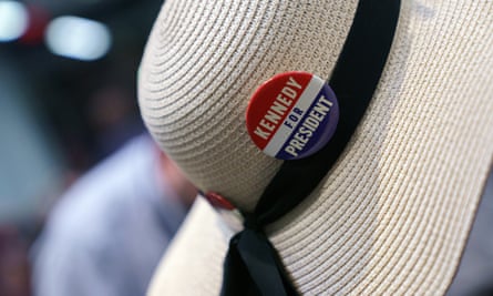 White hat with ribbon and badge attached