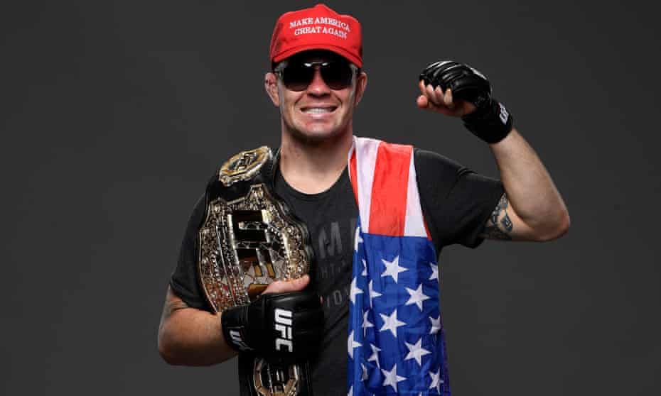 Colby Covington poses with a Make America Great Again cap at UFC Fight Night