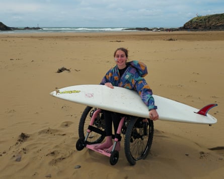 Handley with her board on the beach
