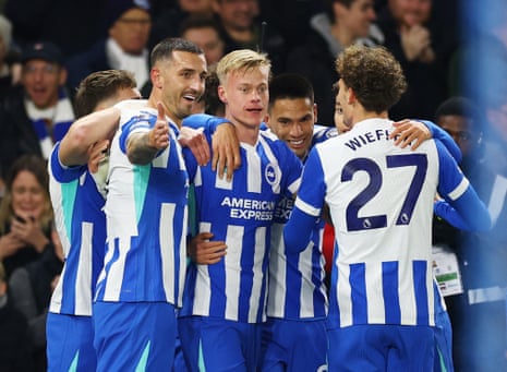 Brighton & Hove Albion's Jan Paul van Hecke (centre) celebrates scoring their first goal with teammates.