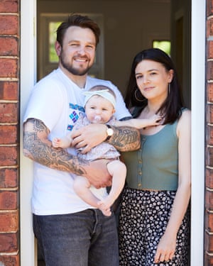 Dan Greenslade and Jade Croft with their daughter Indie in the rented house they're living in after their home was flooded.