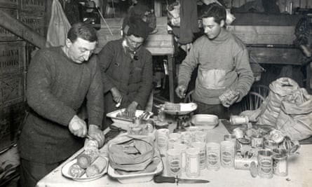 Atkinson, Bowers and Cherry-Garrard preparing a meal in their camp in June 1911.