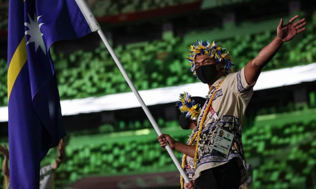 Nauru’s flagbearers Nancy Genzel Abouke (left) and Jonah Harris lead their delegation during the Tokyo 2020 Olympic Games opening ceremony. Olympic opening ceremony,Tokyo 2020,Marco Balich,Arisa Tsubata,Tokyo,harbouchanews