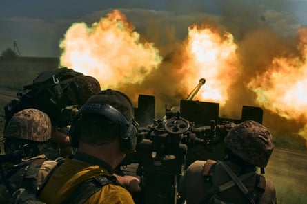 Ukrainian soldiers fire a cannon near Bakhmut, an eastern city where fierce battles against Russian forces have been taking place, in the Donetsk region, Ukraine.