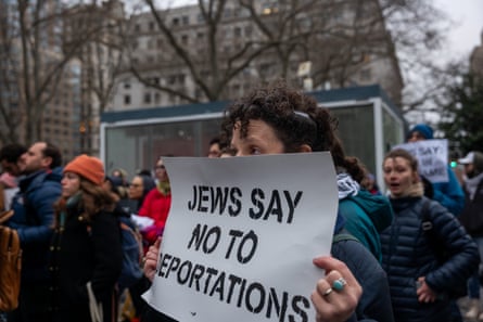 a woman holding a sign