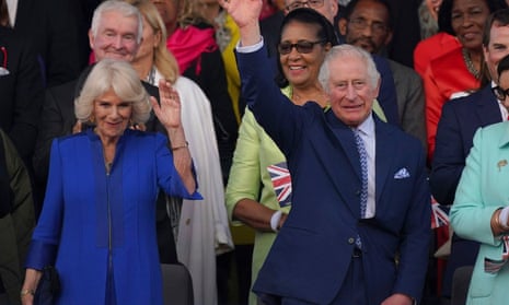 King Charles III and Queen Camilla wave from the Royal Box at the Coronation Concert.