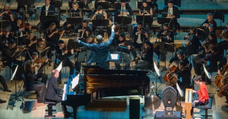 Steven Osborne (left) and Cécile Lartigau (right) with Vasily Petrenko and The Royal Philharmonic Orchestra.