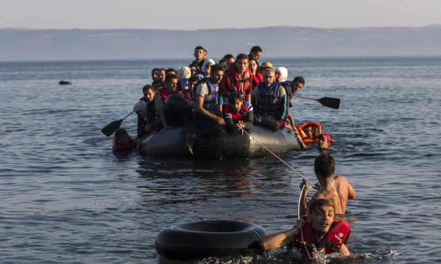 An overcrowded dinghy with refugees