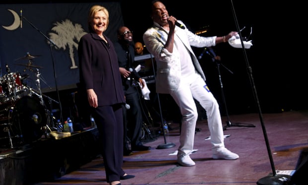 Democratic U.S. presidential candidate Clinton joins singer Wilson on stage during a get-out-the-vote concert in support of her at the Music Farm in Charleston, South Carolina.