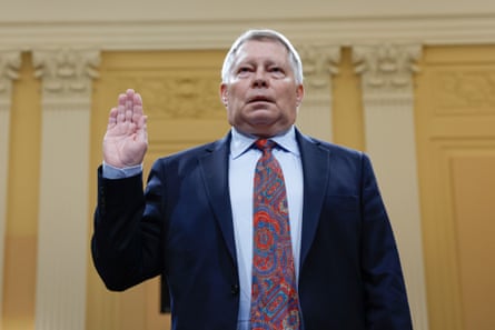a man with his hand raised