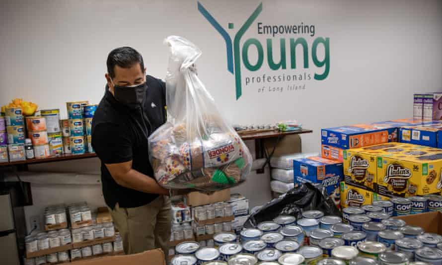 Luis Mendez organizes food boxes to send to minorities in need during the Covid-19 lockdown in Garden City, New York.