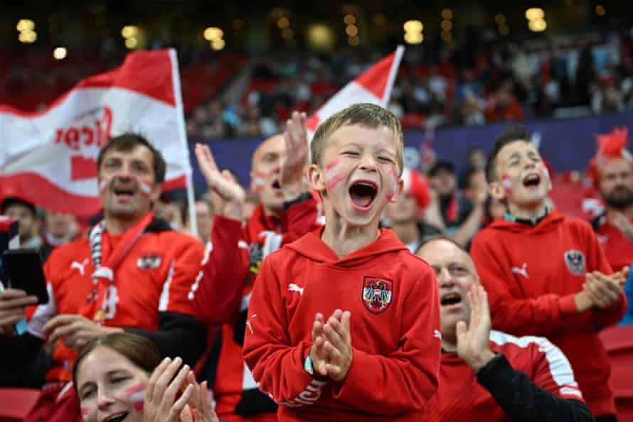 Young Austria supporters raise the atmosphere inside the stadium ahead of kick-off.