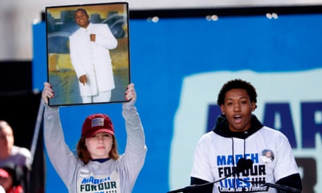 Trevon Bosley addresses the crowd in Washington as a friend holds up a picture of his murdered brother Terrell.