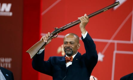 Sheriff David Clarke holds up a rifle that was presented to him as part of his Charlton Heston Courage Under Fire Award at the 2015 Conservative Political Action Conference in Maryland.