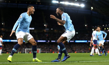 Raheem Sterling celebrates with Manchester City teammate Danilo after scoring the goal against Bournemouth which takes him joint top of the Premier League scoring charts.