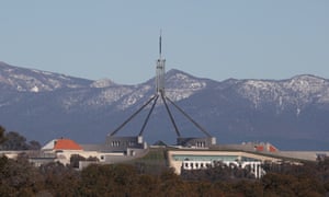 Snow on the Brindabella Ranges behind Parliament House in Canberra