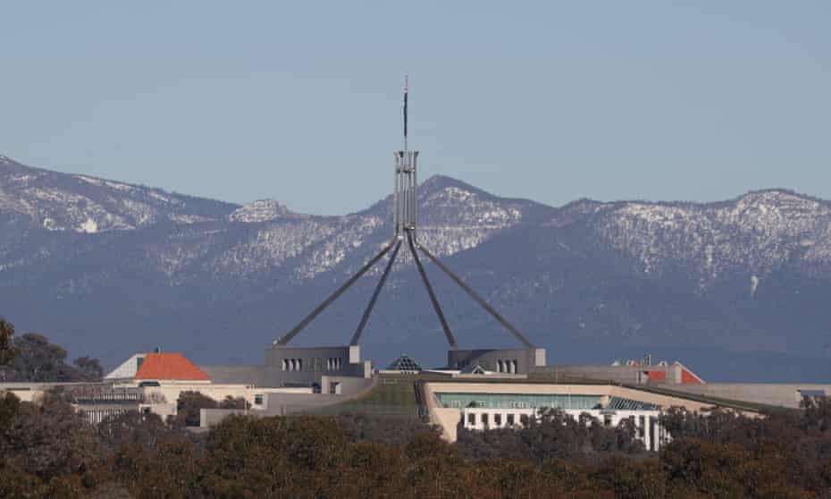 Snow on the Brindabella Ranges behind Parliament House in Canberra