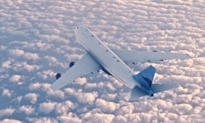 plane airborne over the sea