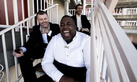 Gabriels’ Jacob Lusk, centre, with Ryan Hope and Ari Balouzian, sitting on a staircase and laughing