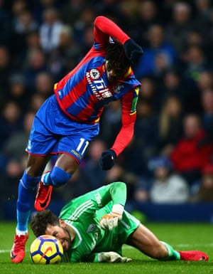 Ben Foster of West Bromwich Albion attempts to head the ball while under pressure from Wilfried Zaha of Crystal Palace during the 0 v 0 draw between West Bromwich Albion and Crystal Palace at The Hawthorns. Alan Pardew became the fifth manager to take charge of at least five different Premier League clubs. He has won three and drawn two of his opening games with his five sides.