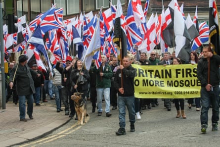 People march carrying union and St George flags with a banner saying ‘Britain first. No more mosques.’ People march carrying union and St George flags with a banner saying ‘Britain first. No more mosques.’