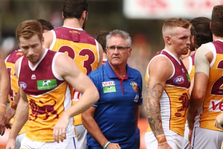 Chris Fagan with Lions players on the field in preseason 2017