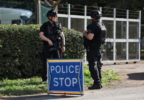 Armed police enforce a cordon outside RAF Fairford in Gloucestershire, England.