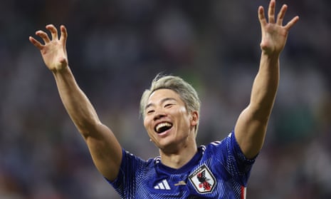 Takuma Asano celebrates scoring Japan's winner against Germany