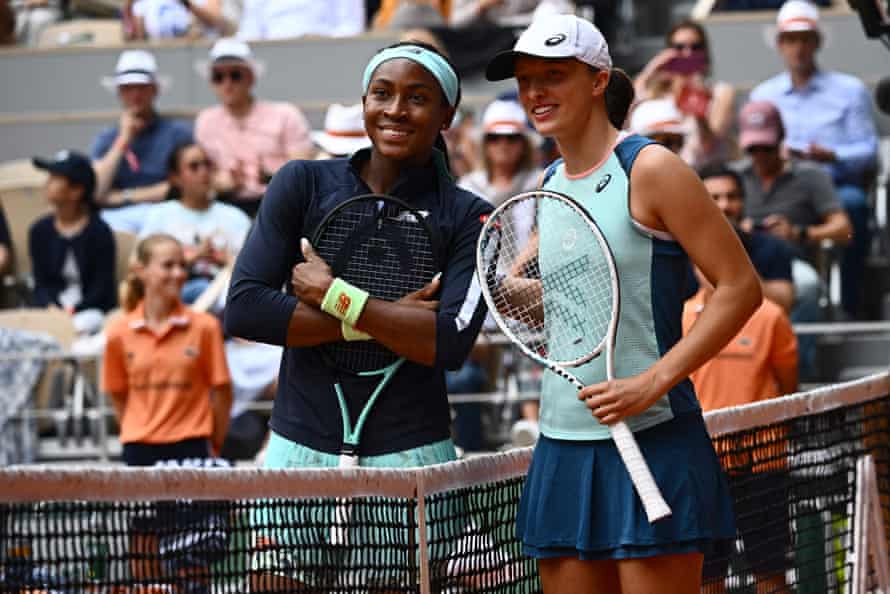 Coco Gauff (left) and Iga Swiatek pose before the start of their women's singles final.