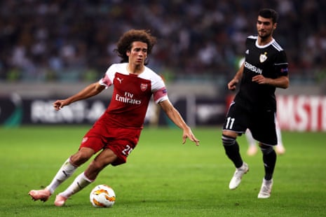 Matteo Guendouzi of Arsenal runs with the ball under pressure from Mahir Madatov of Qarabag.