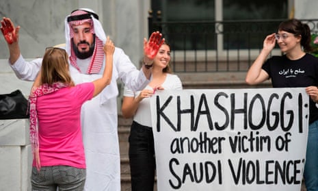 A demonstrator with fake blood on his hands dresses as Mohammed bin Salman, the crown prince of Saudi Arabia, outside the Saudi embassy in Washington
