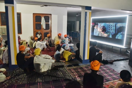 People gather to watch a special screening of the film Satluj at a Sikh temple in Punjab's Gurdaspur district in India.