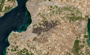 A burn scar from covers a large portion of the city.